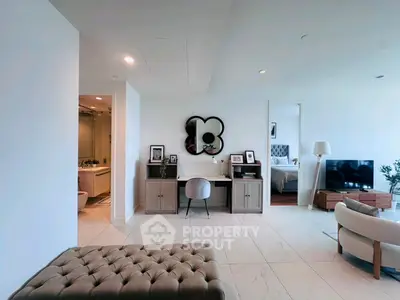 Spacious modern living room with elegant decor and open layout, featuring a cozy seating area and stylish furnishings.