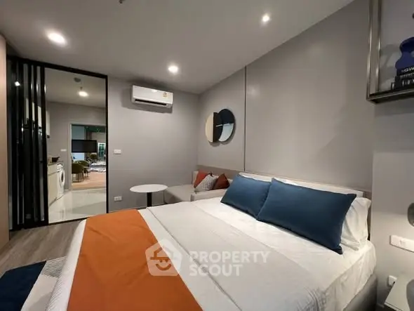 Modern bedroom with stylish decor and cozy ambiance in a contemporary apartment.