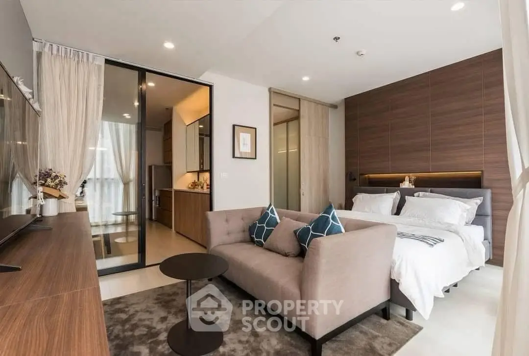 Modern studio apartment with cozy living area and stylish bedroom