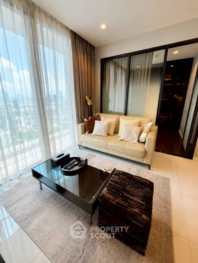 Luxurious living room with stunning city view, elegant decor, and floor-to-ceiling windows in modern apartment.