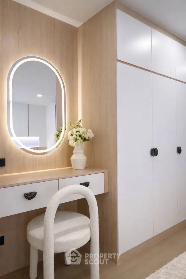 Elegant modern bedroom with stylish vanity and built-in wardrobe