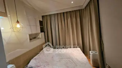 Cozy bedroom with modern lighting and elegant curtains, perfect for restful nights.