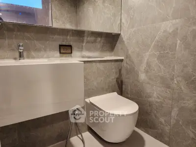 Modern bathroom with sleek design and elegant marble tiles