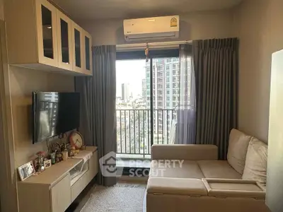 Cozy living room with modern decor and city view from balcony