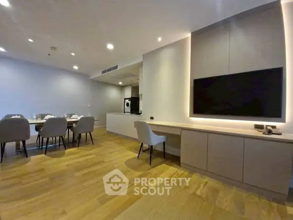 Spacious modern living room with dining area and sleek wooden flooring