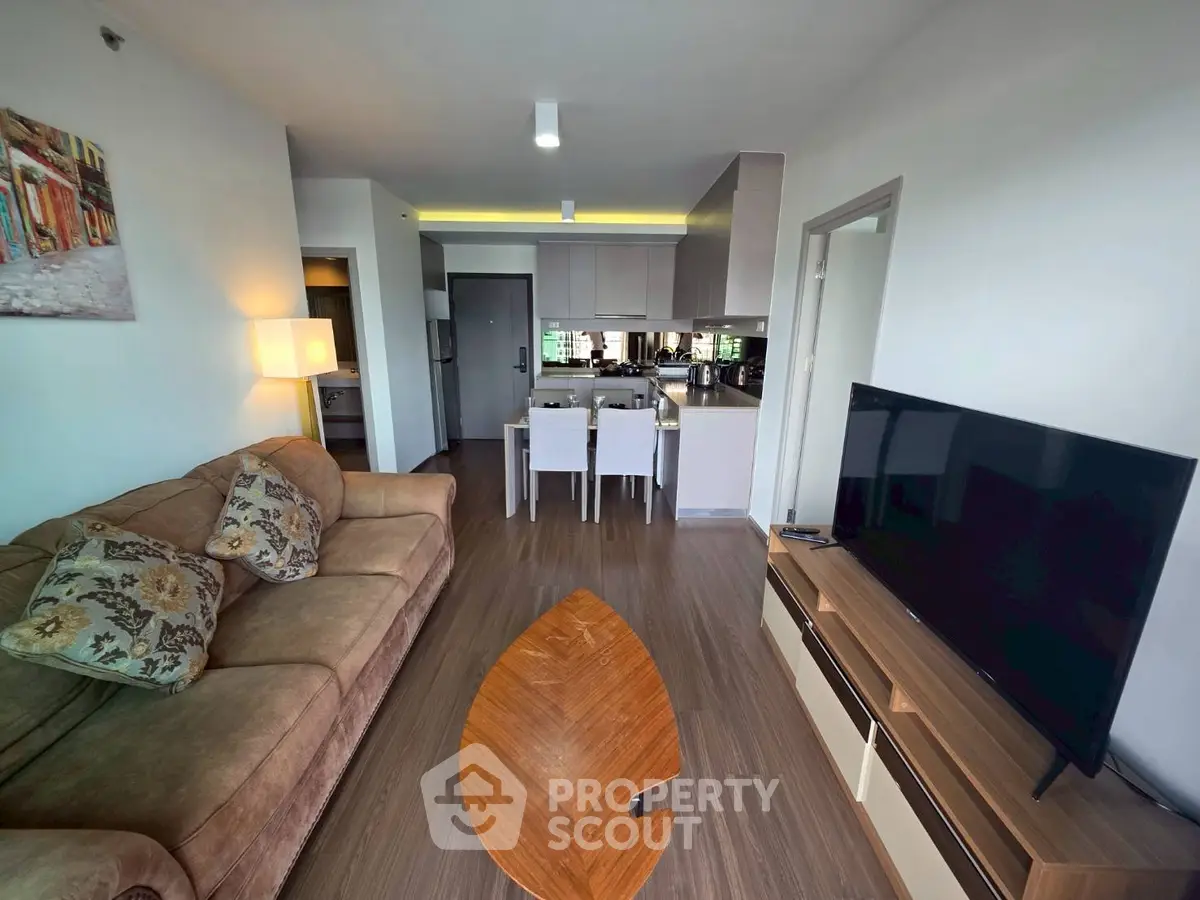 Modern living room with cozy sofa and sleek TV setup