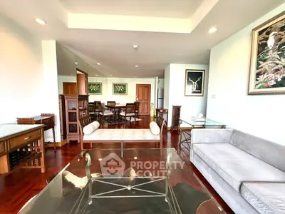 Spacious living room with elegant decor and hardwood floors in a modern apartment.