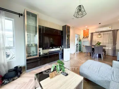 Modern living room with stylish decor and open dining area