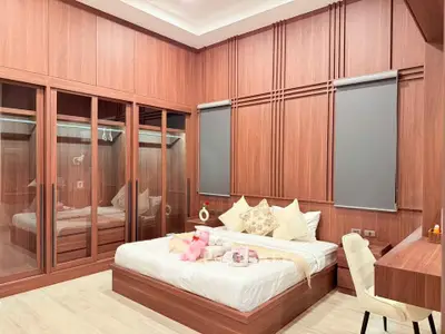 Luxurious bedroom with wooden paneling and elegant decor