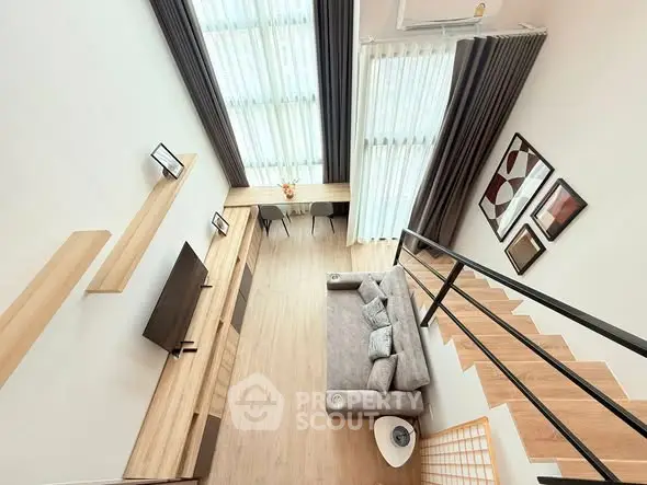 Modern loft-style living room with high ceilings and elegant decor