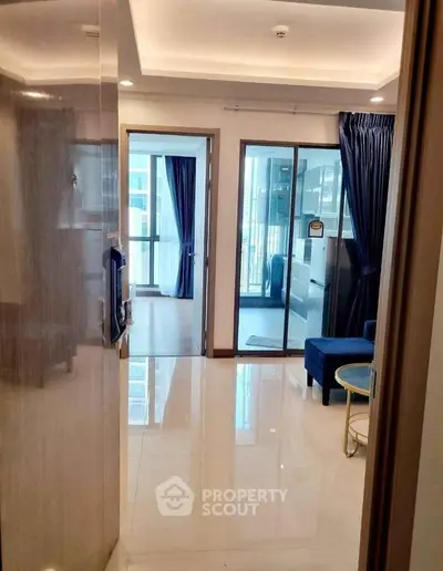 Modern apartment entrance with glossy floors and elegant decor