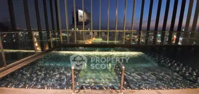 Stunning rooftop pool with panoramic city views at dusk, perfect for luxury living.