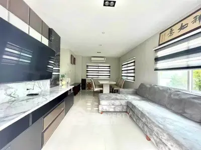 Modern living room with sleek design and ample natural light