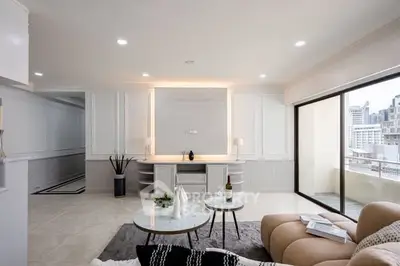 Luxurious living room with elegant decor and city view balcony