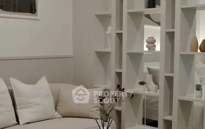 Modern living room with stylish shelving and cozy seating area