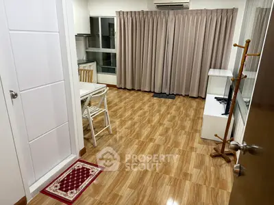 Spacious living room with wooden flooring and modern furnishings