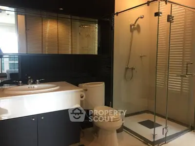 Modern bathroom with glass shower and sleek fixtures