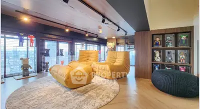 Luxurious living room with modern decor and plush seating in a high-rise apartment.