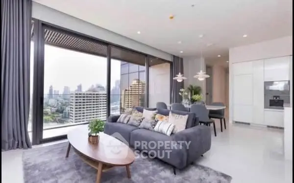 Luxurious modern living room with stunning city view and open kitchen layout.