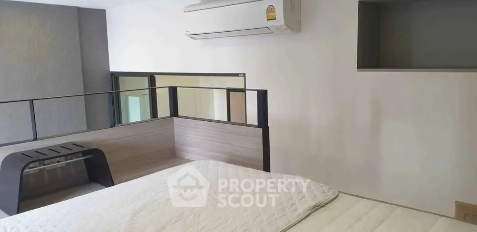 Modern bedroom with air conditioning and stylish decor in a contemporary apartment.