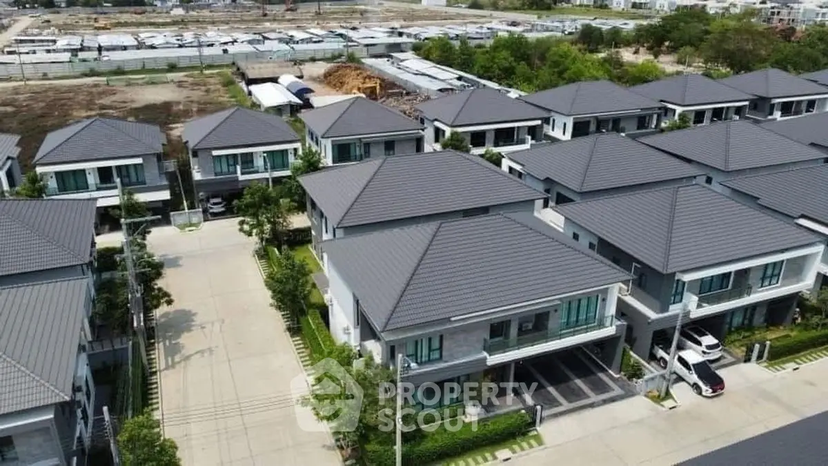 Modern residential neighborhood with spacious houses and well-maintained streets.