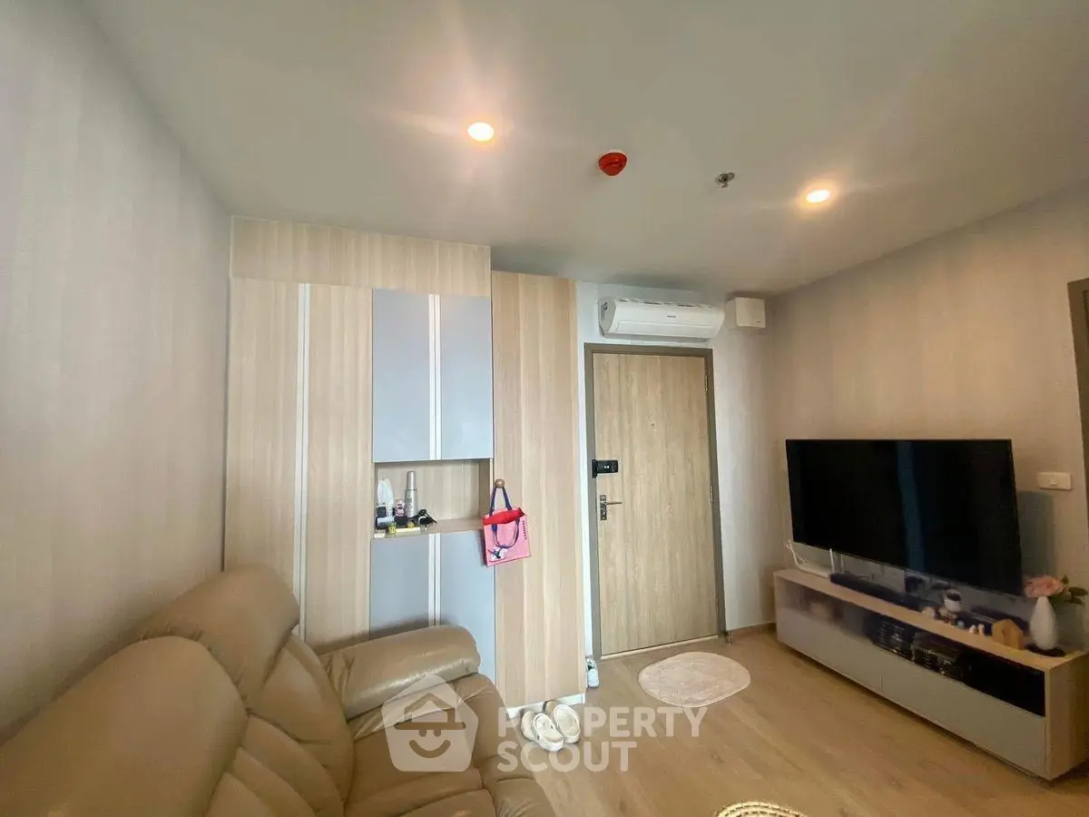 Modern living room with sleek design and cozy leather sofa