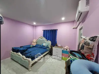 Charming bedroom with elegant bed and vibrant decor in cozy real estate listing.