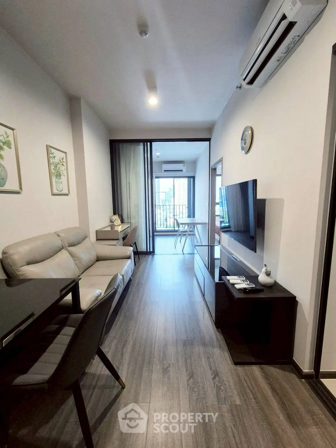 Modern living room with sleek design and balcony view