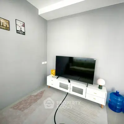 Modern living room with sleek TV setup and minimalist decor