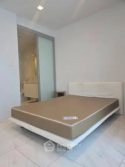 Modern bedroom with minimalist design and ensuite bathroom