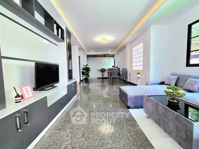 Spacious modern living room with sleek design and open layout, perfect for entertaining.