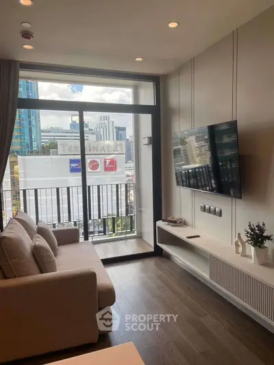 Modern living room with city view, sleek furniture, and large window balcony access.
