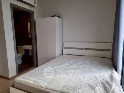 Spacious bedroom with ensuite bathroom and natural light