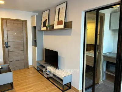 Modern living room with stylish decor and sliding glass door to bathroom