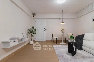 Modern living room with minimalist decor and cozy seating area
