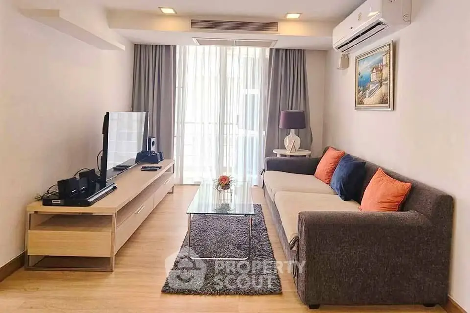 Spacious modern living room with stylish decor and natural light