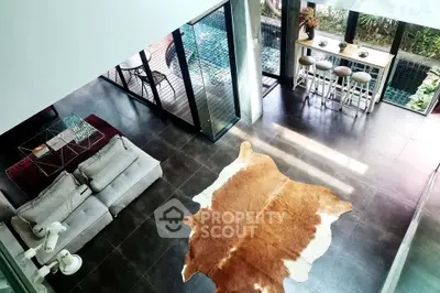 Luxurious modern living room with pool view and stylish decor