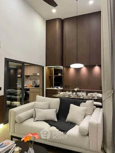 Luxurious modern living room with high ceilings and elegant dining area