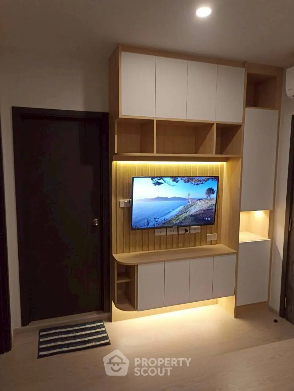 Modern living room with stylish decor and ambient lighting