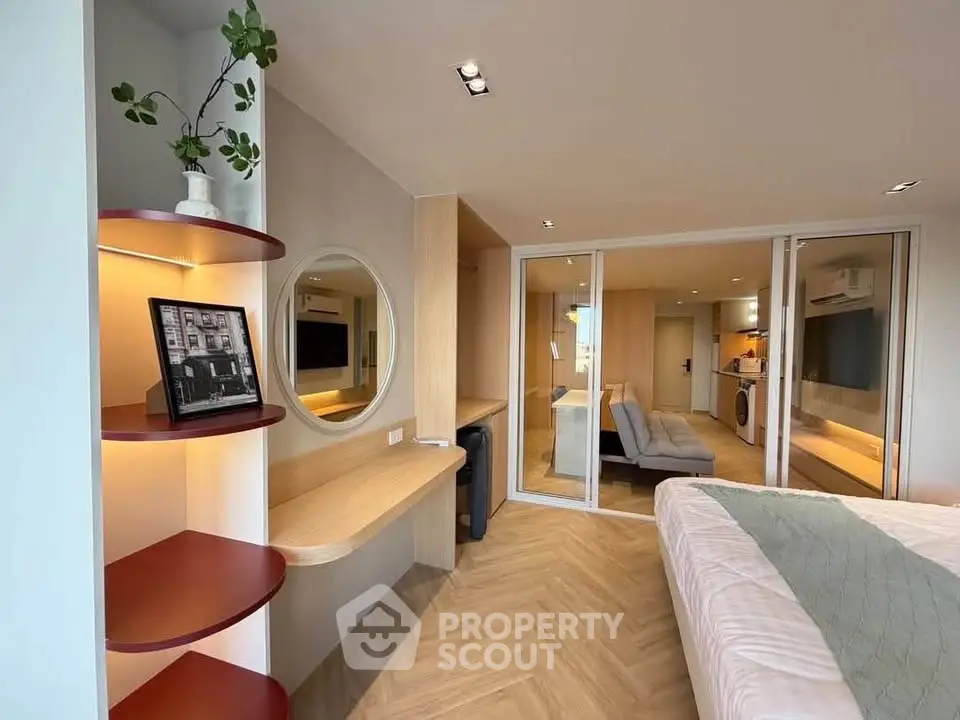 Modern bedroom with stylish decor and open layout in a contemporary apartment.