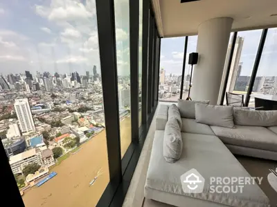 Luxurious high-rise apartment with panoramic city views and modern interior design.