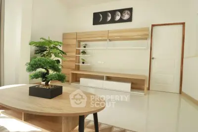 Modern living room with minimalist furniture and decorative plant