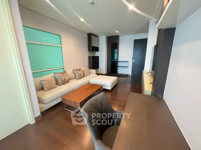 Modern living room with stylish furniture and wooden flooring in a contemporary apartment.