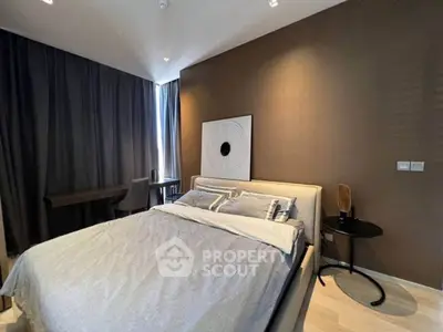 Modern bedroom with stylish decor and cozy ambiance, featuring a comfortable bed and elegant furnishings.