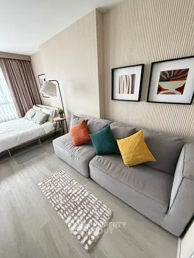 Modern living room with stylish decor and cozy seating in a contemporary apartment.
