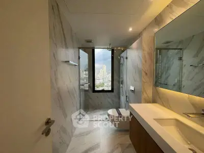 Luxurious bathroom with city view, modern fixtures, and elegant marble design.