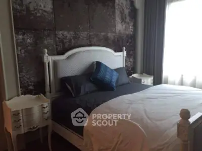 Elegant bedroom with vintage bed and stylish decor, perfect for cozy living.