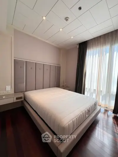 Spacious bedroom with elegant design and natural light