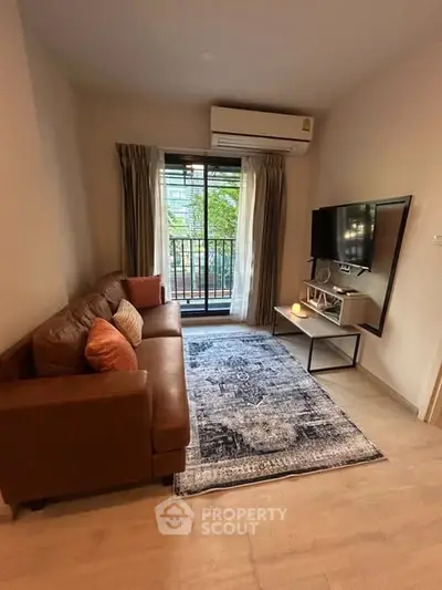 Cozy living room with modern decor and balcony view