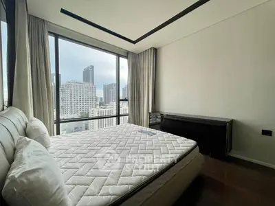 Luxurious bedroom with stunning city view and modern furnishings